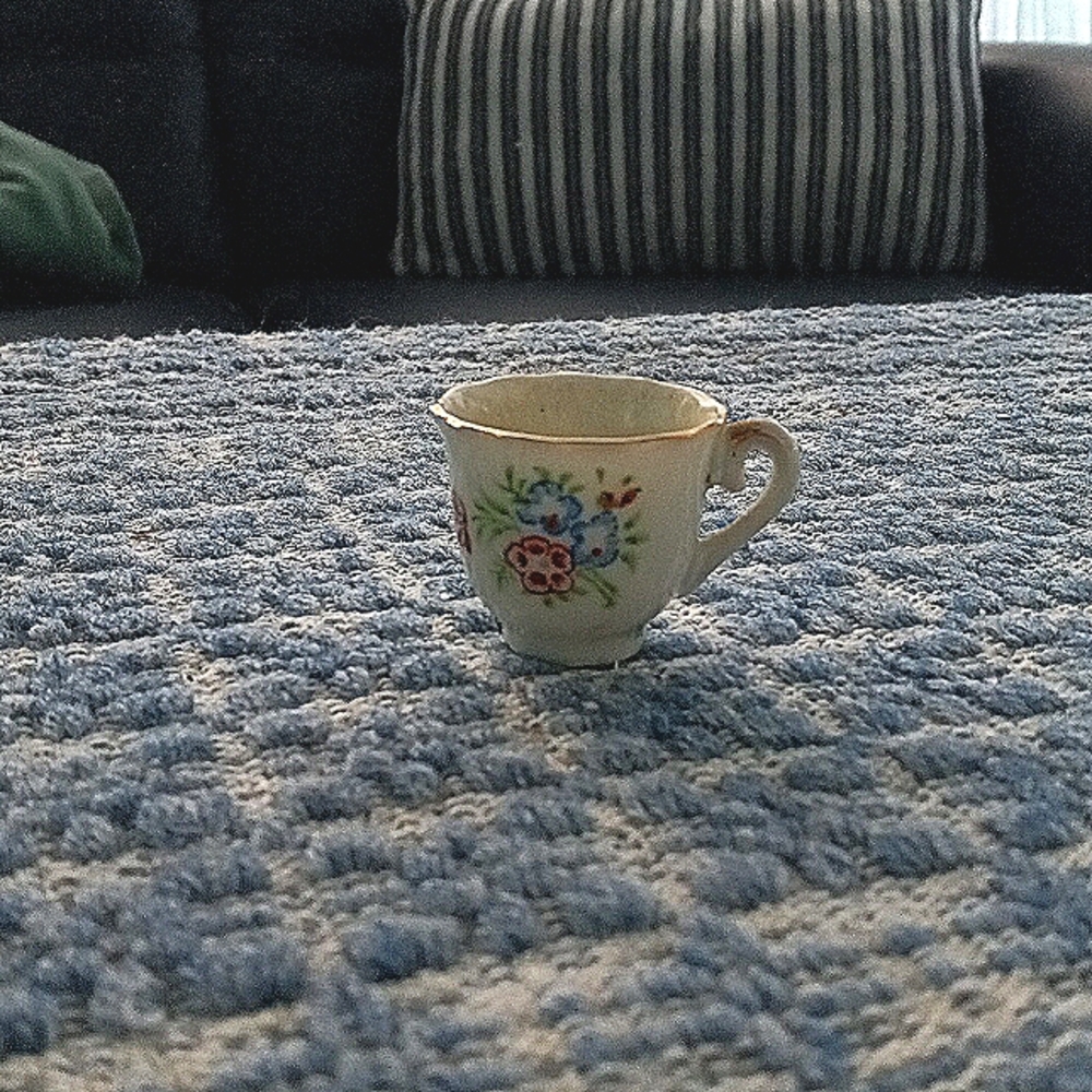 Itty bitty porcelain tea cup